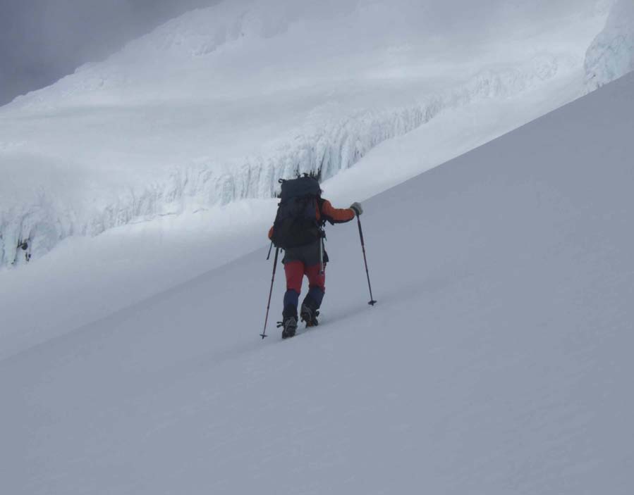 Robert with ski poles ascending