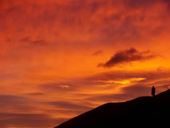 Fiona taking in the sunrise on the Lindis Pass near our bivvy spot