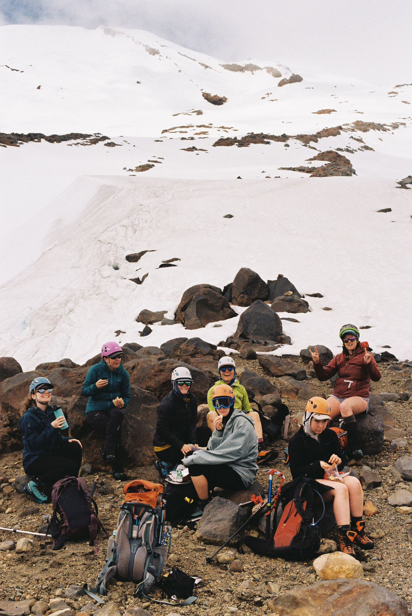 The group stopping for a lunch break on the slopes