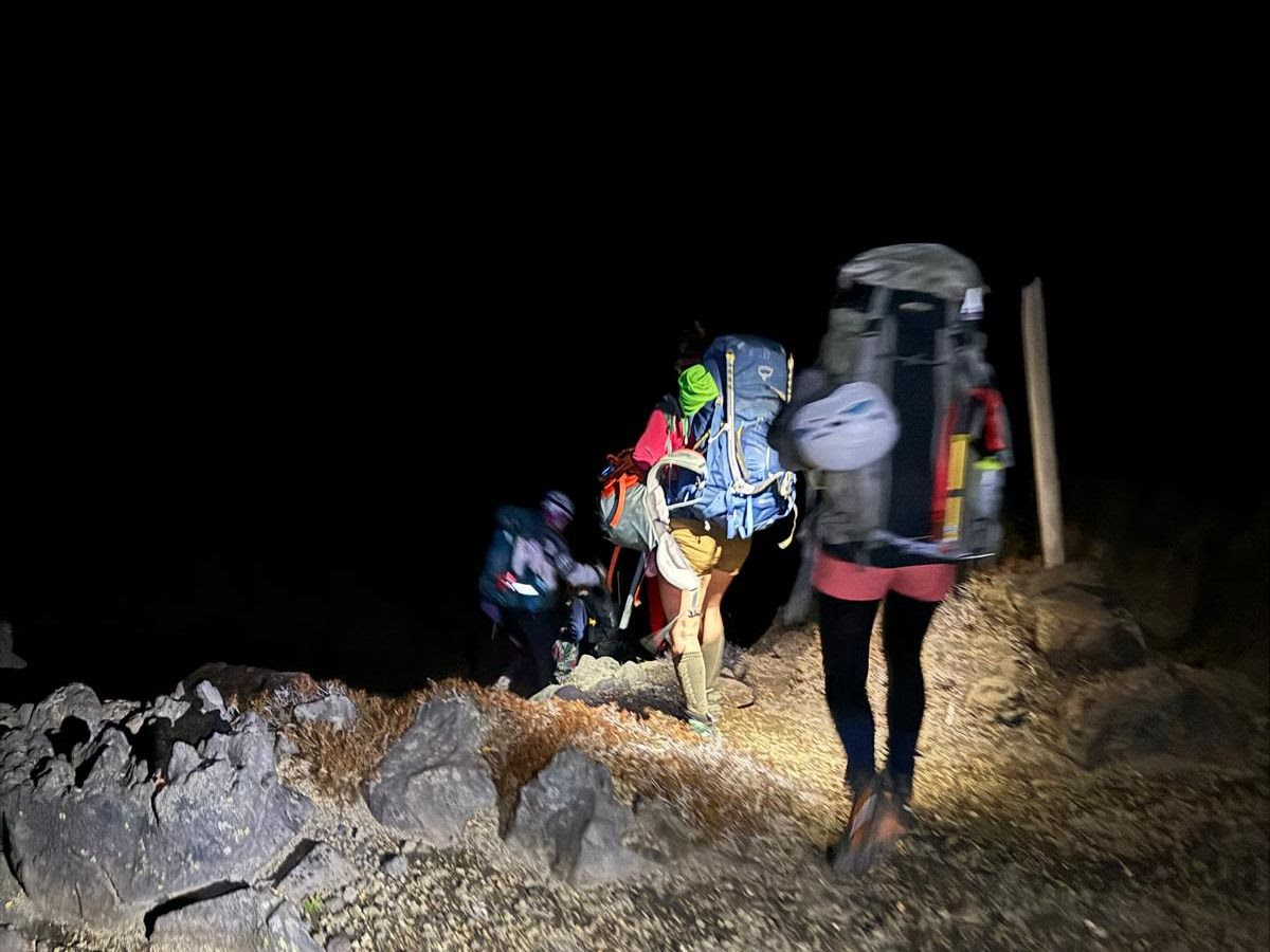 The group leaving the mountain late at night