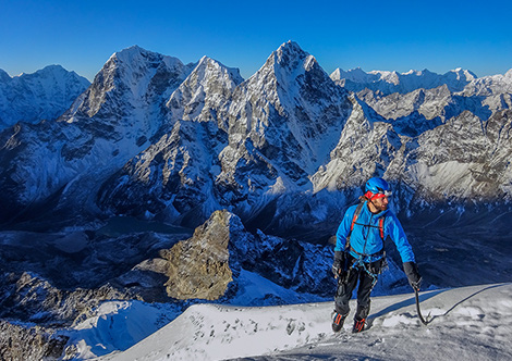 Kim Ladiges nearing the false summit of Lobuje East on an acclimatisation climb of the West Ridge, the North Face of Cholatse behind him