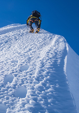 On the false summit, contemplating the exposure ahead on a short final pitch between us and the true summit