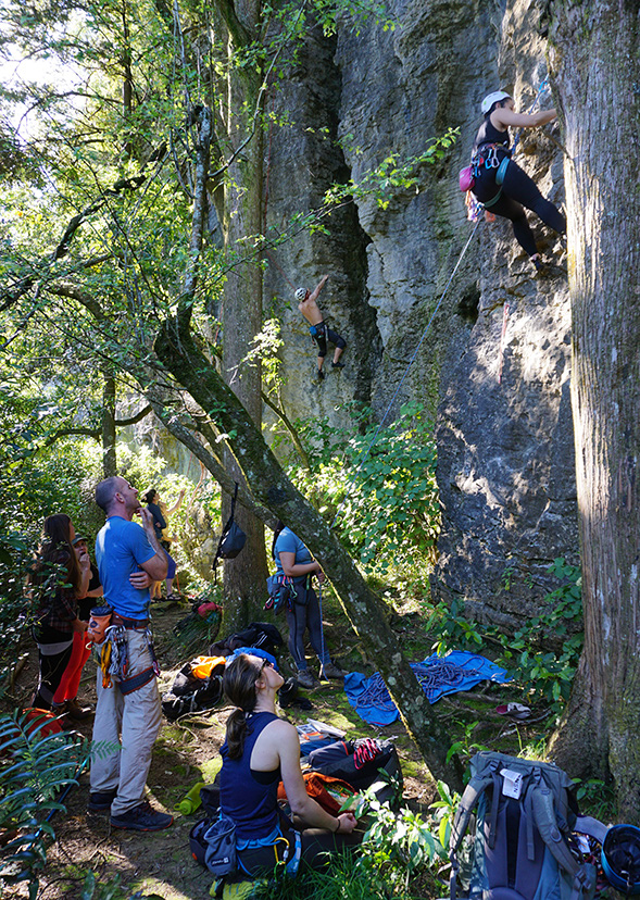 The team at Rhinoceros Wall watching Marie work out the beta on &lsquo;Rhinoceros&rsquo; before attempting it themselves